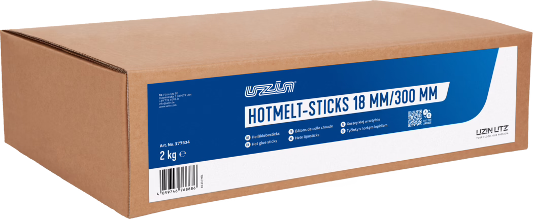 UZIN_Dummy_Hotmelt Sticks-2kg_2023-10 Brown corrugated cardboard box with a blue-and-white label reading 'HOTMELT-STICKS 18 MM/300 MM'. The brand 'UZIN UTZ' is visible. The label shows the weight '2 kg', article number 'Art. No. 177534', a barcode and small multilingual product descriptions. The photo shows the front and top of the sealed rectangular shipping box on a white background.