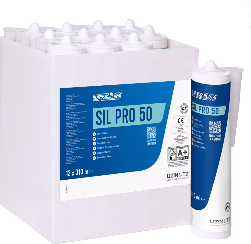 A white cardboard box holding twelve white plastic cartridges of SIL PRO 50 construction silicone (12 x 310 ml) with blue-and-white labels; one cartridge stands upright outside the box showing the product name, brand logo, QR code and volume marking on a clean white background.